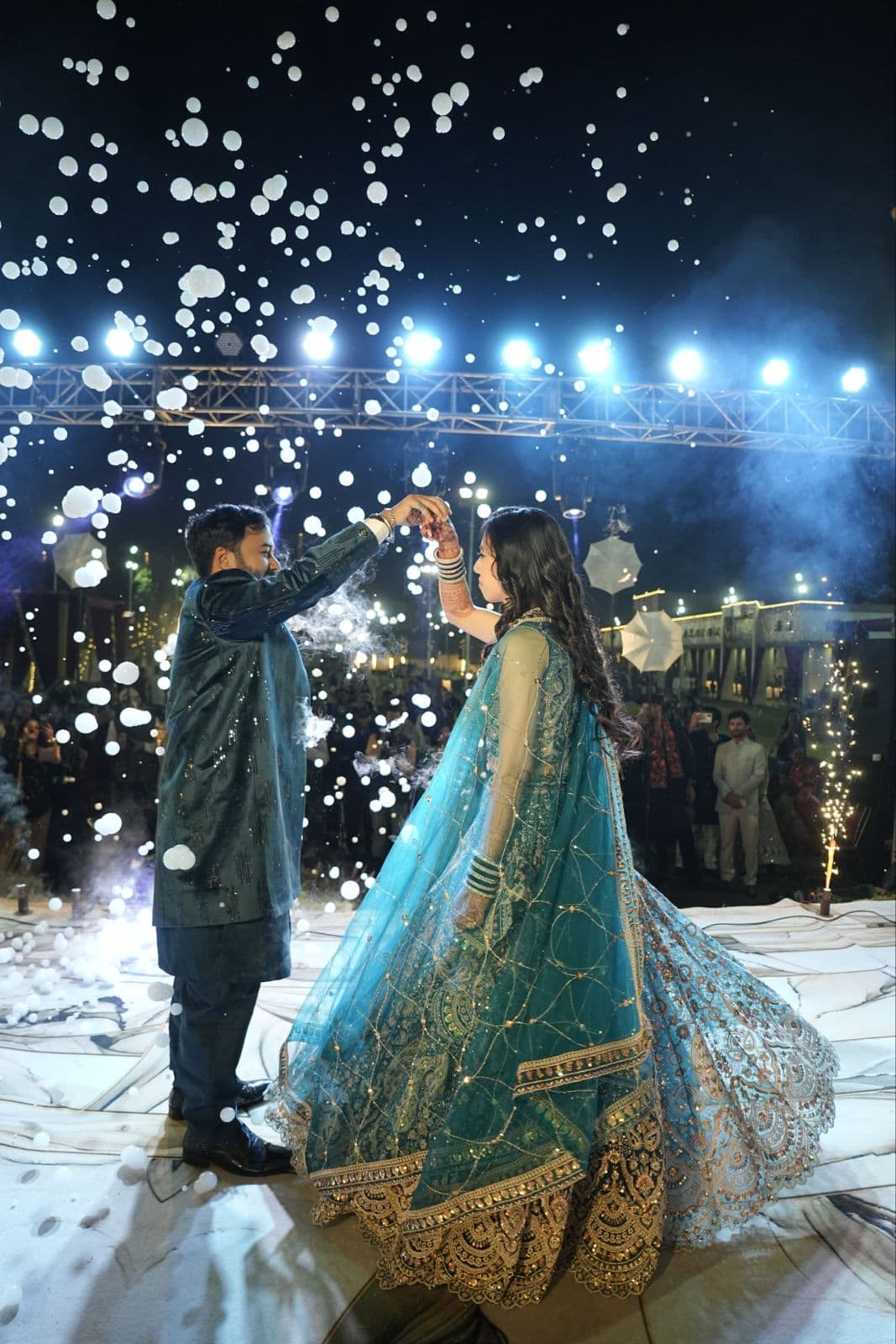Wedding photography — raw emotional first dance moment with confetti