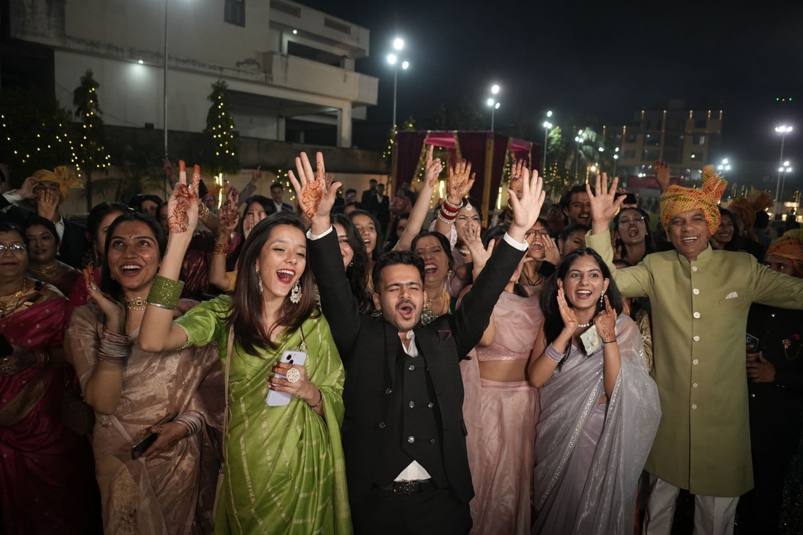 Indian wedding celebration — guests cheering background